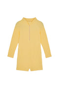 Front view of Hilo One Piece Kids in Honey Crinkle, crinkle textured fabric with long sleeves, front zip, and short legs on white background