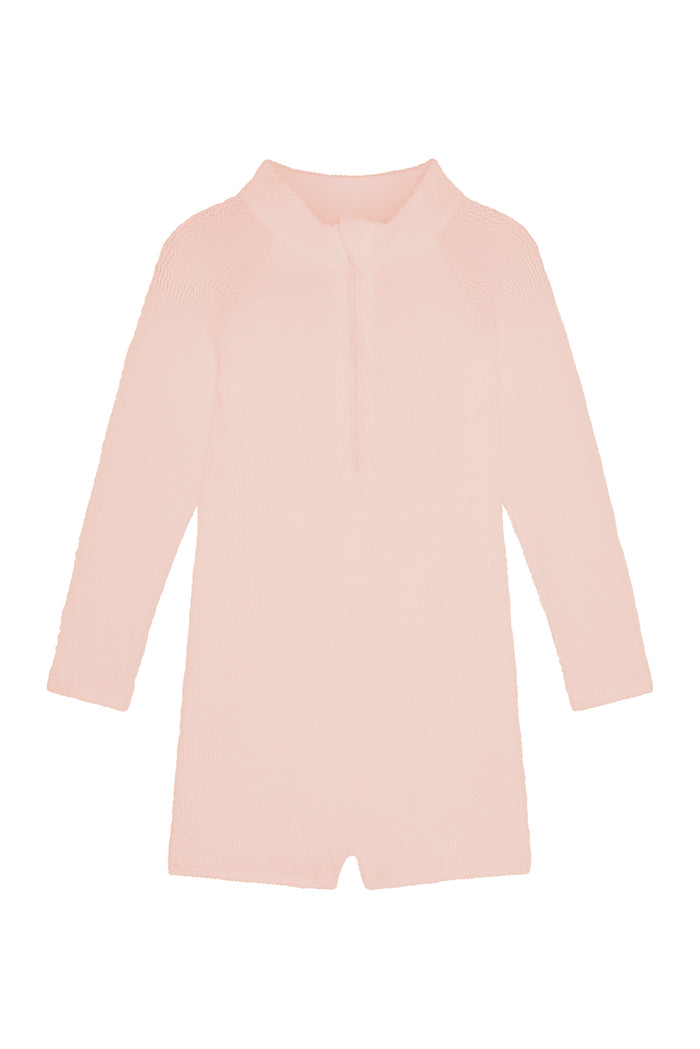 Front view of Hilo One Piece Kids in powder pink crinkle showing long sleeves and center front zipper on white background