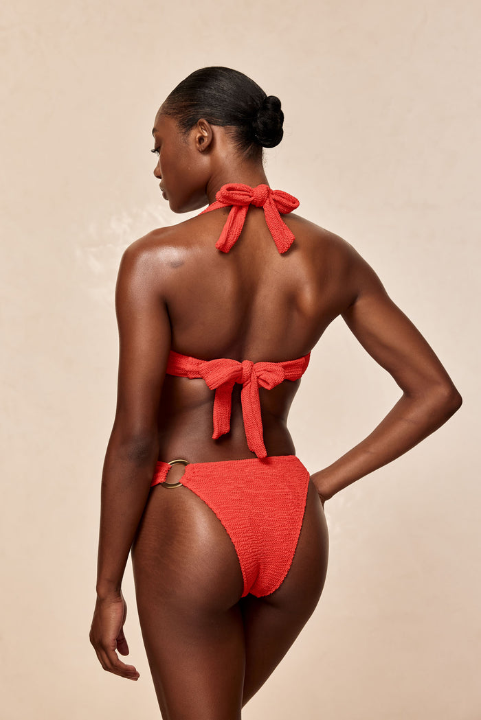Back view of Bronte Bottom in Chili Pepper Crinkle, textured high‑cut cheeky style with gold ring hip detail
