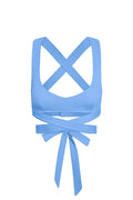 Light blue women's wrap sports bra with crisscross straps and long tie-back bow