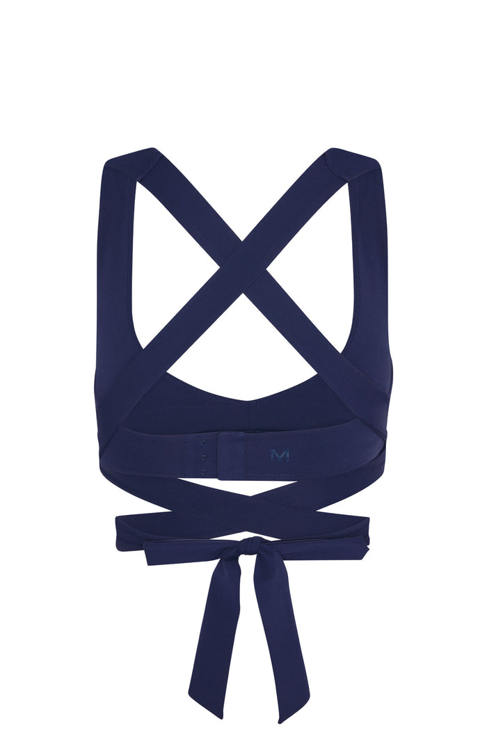 Back view of Hudson Bra in midnight showing crossed straps, adjustable hook-and-eye band and tie wrap on white background