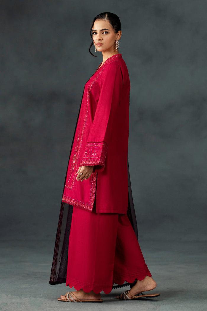 Side pose of NAQSHI Humaira ready-to-wear party outfit in shocking pink cotton satin with detailed sleeve embroidery and flowing dupatta for special occasions