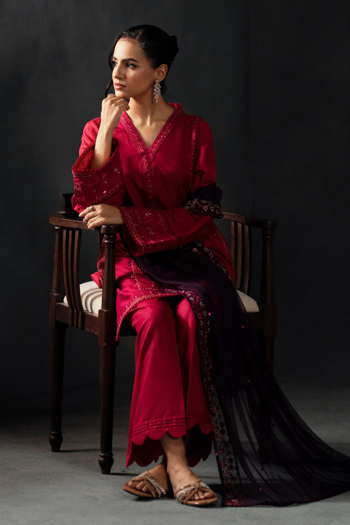 Styled presentation of NAQSHI Humaira formal set in shocking pink with embroidered embellishments, ideal for wedding events and festive gatherings