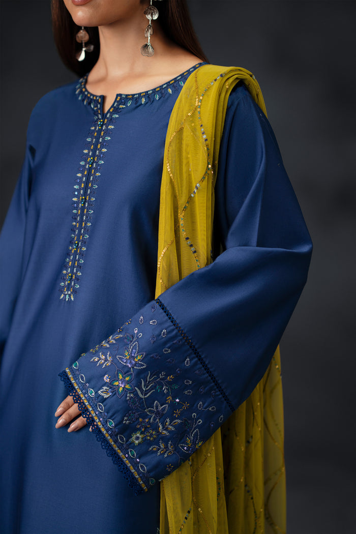 Close-up detail view of NAQSHI Irha blue shirt sleeve embroidery with mustard dupatta texture for party and event attire