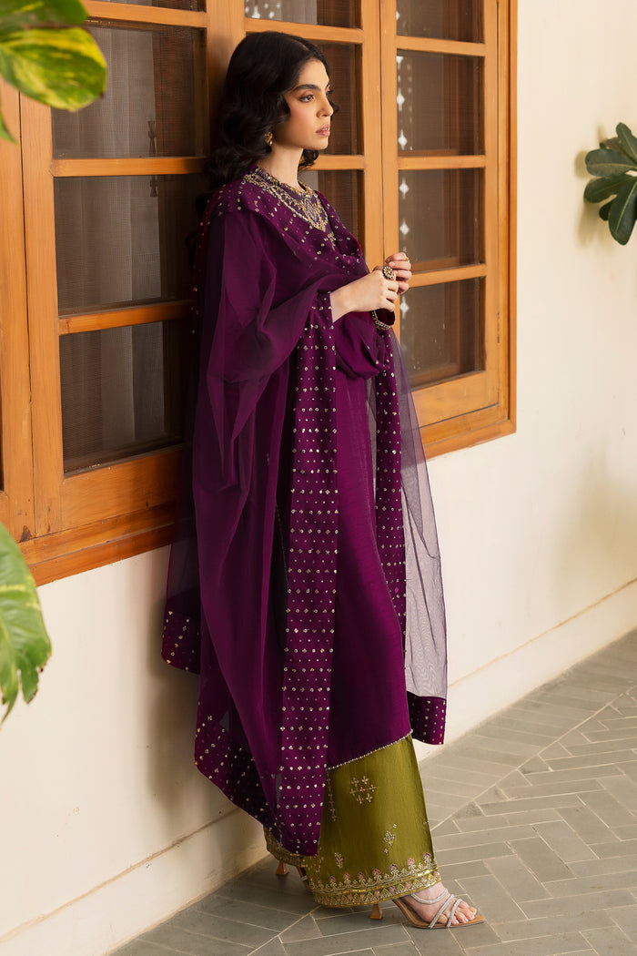 Close-up of NAQSHI Irma olive-green raw-silk culottes featuring thread embroidery, sequin motifs & border detail echoing the shirt’s embellishment style.