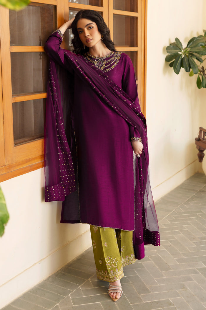 Detailed shot of NAQSHI Irma shirt hem showing pure hand-adda work—kora, dabka, sitara, cut dana, crystals & stonework—on wine-purple raw silk.