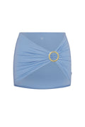 Front view of Jamaica sarong in azure showcasing twisted wrap front with gold ring hardware on white background