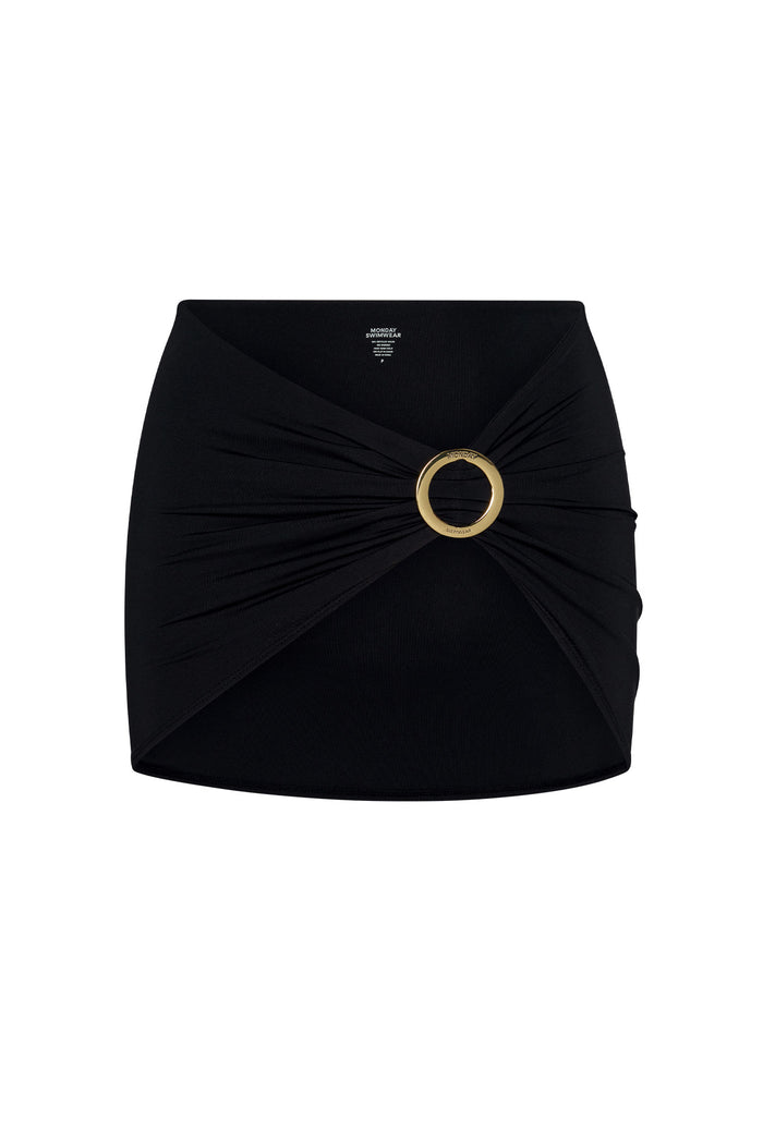 Top-front view of Jamaica Sarong in black showcasing twisted ruched wrap and branded gold O-ring buckle on a white background