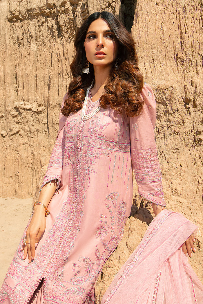 Side angle of tea pink embroidered lawn shirt with V neckline and lace details paired with culotte trousers women occasion wear