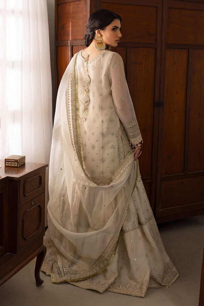 Rear of NAQSHI Jeena shirt highlighting chunky handmade tassels at back, repeated floral embroidery motifs and neat cutline.