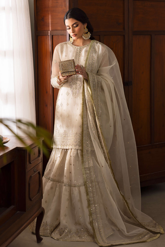 Close-up of NAQSHI Jeena gypsy gharara in organza with lavender hue detailing, embroidered borders, sequins and flowy flare.