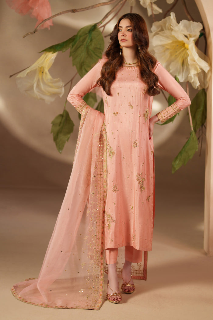 Full front look of NAQSHI Jinan luxury pret dress in peach pink with delicate embroidery and sheer dupatta, styled for festive events.