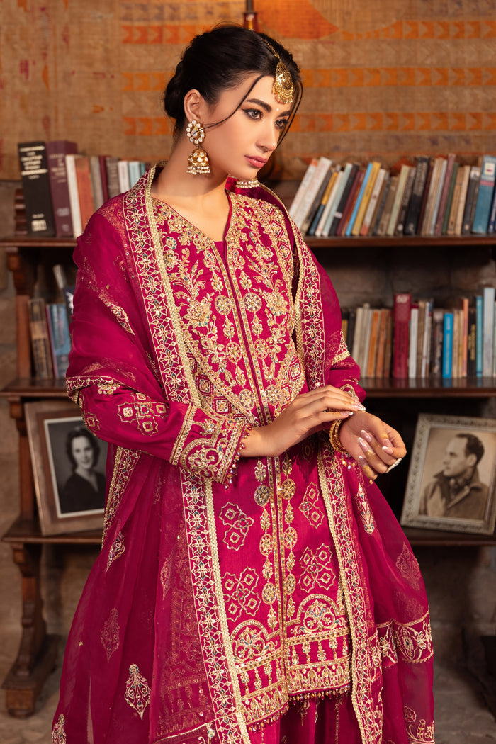 Side shot of naqshi kaavish showing front mid-slit bordered with embroidered crystal droplets and intricate ban neckline embellishments.