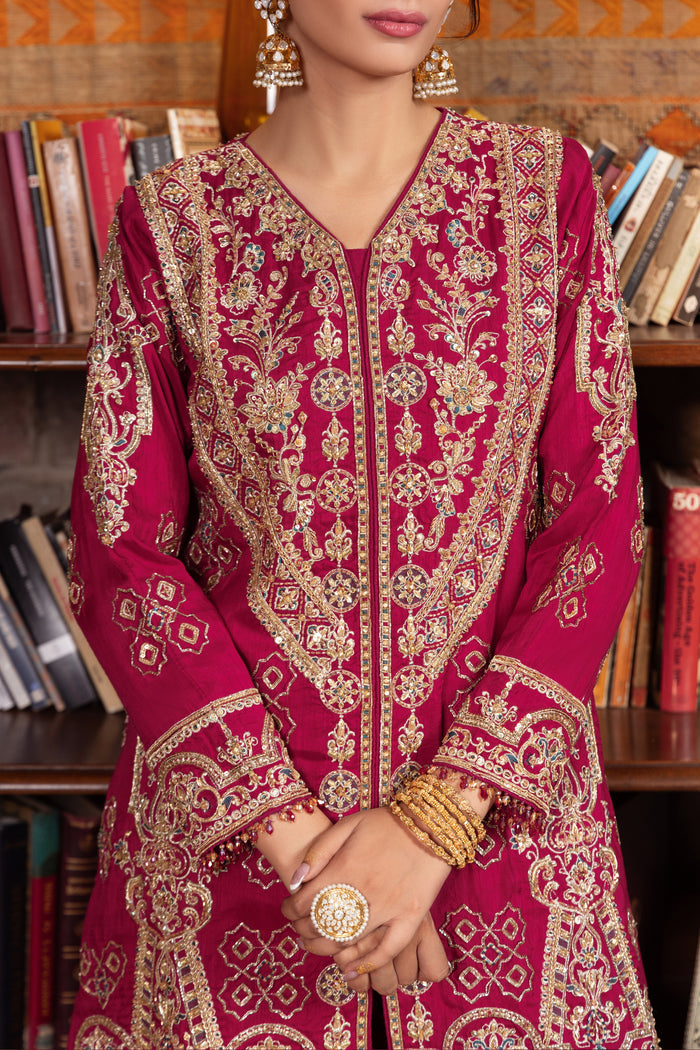 Naqshi kaavish berry‑pink Indian raw‑silk A‑line gown with boat neckline, dense hand‑adda embroidery—kora, dabka, crystals, sitari, cut‑dana, tilla, payal, naqshi motifs.