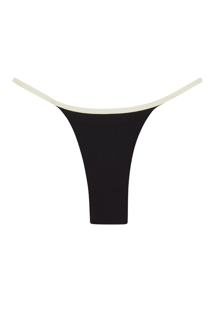 Close-up front view of Kauai Bottom in Black/Ivory showcasing high-cut thong and contrasting ivory waistband on white background
