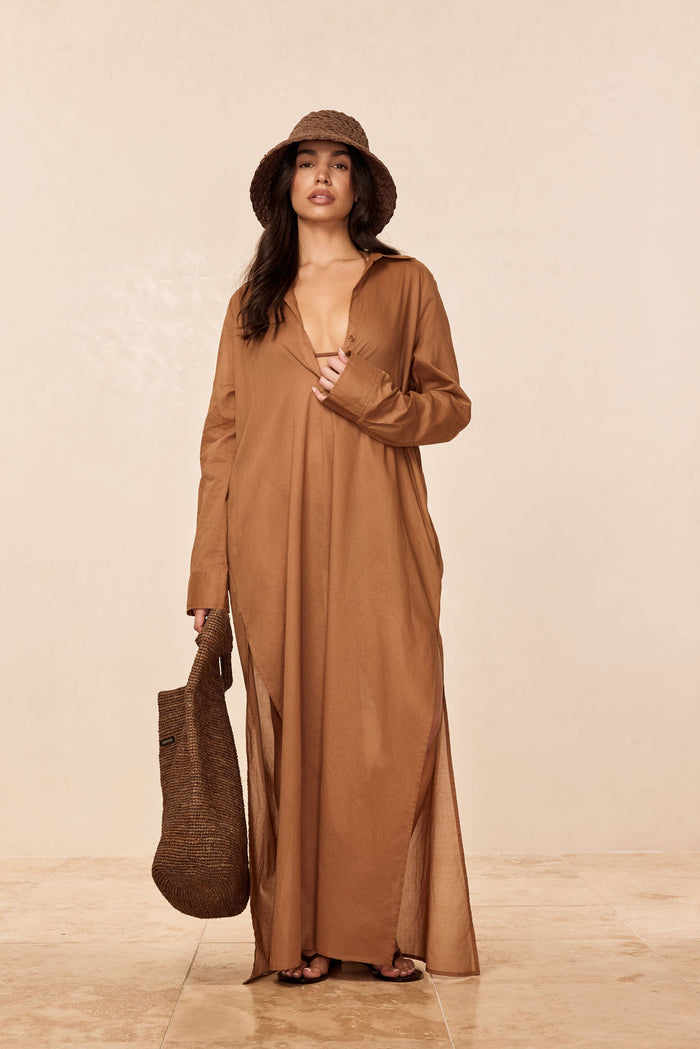 Front view of Kokomo Kaftan - Caramel showcasing cotton-voile fabric, deep V front, long sleeves and side slits on a beige background