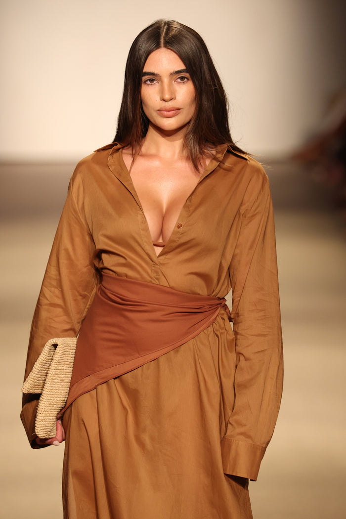 Front view of Kokomo Kaftan in caramel on model showcasing deep V neckline, long sleeves and wrapped waist sash