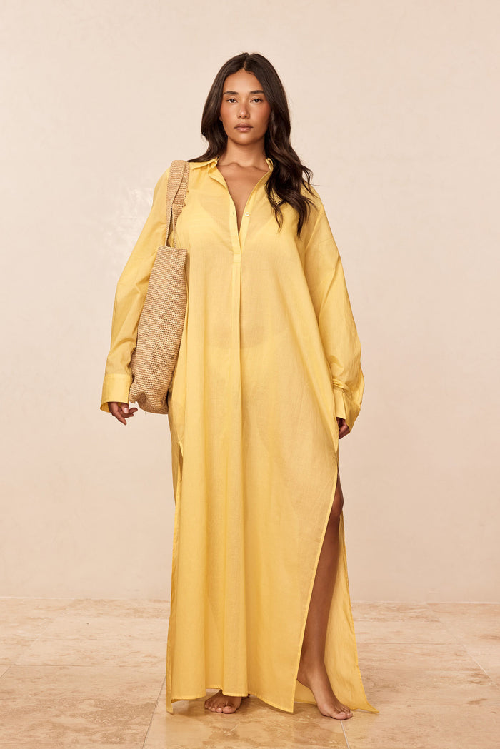 Front of Kokomo Kaftan in Meyer cotton voile on model showing collar, front buttons, pocket detail, sleeves and side slit