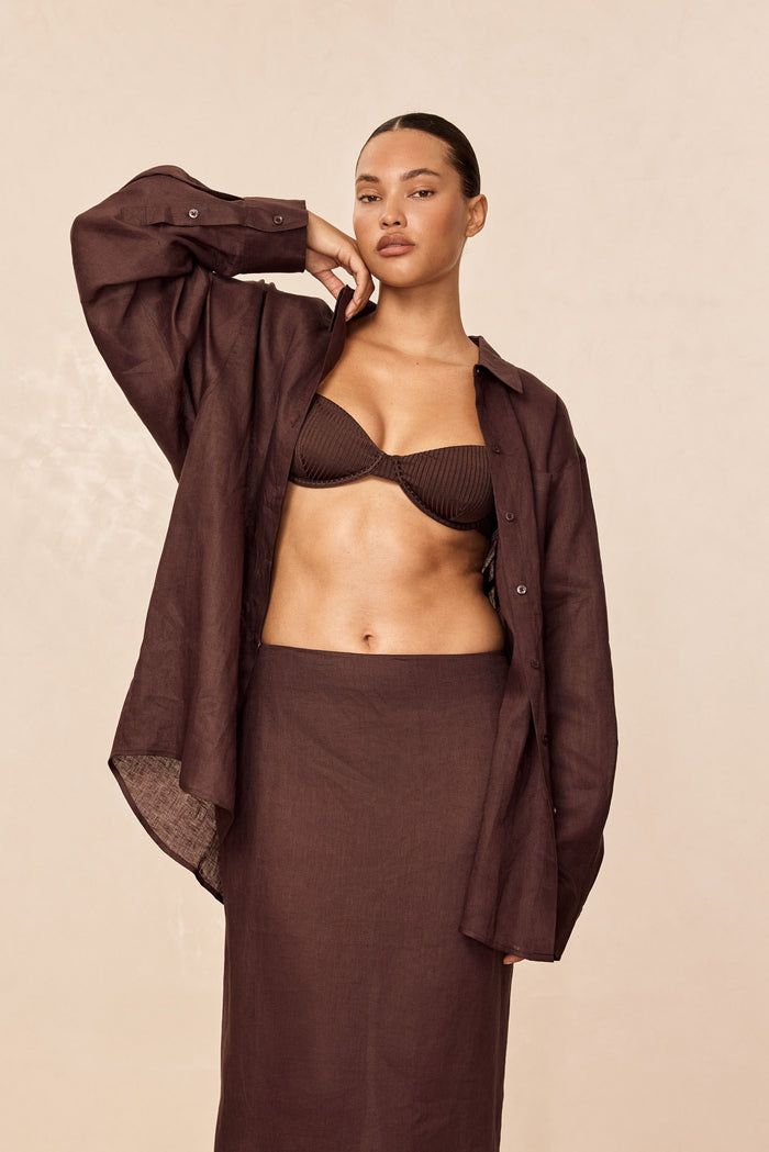 Front view of La Jolla Linen Shirt in espresso, worn open on model to show relaxed oversized fit and linen texture