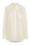 Front view of La Jolla linen shirt in ivory showing button-front, chest pocket, long sleeves and curved hem on white background