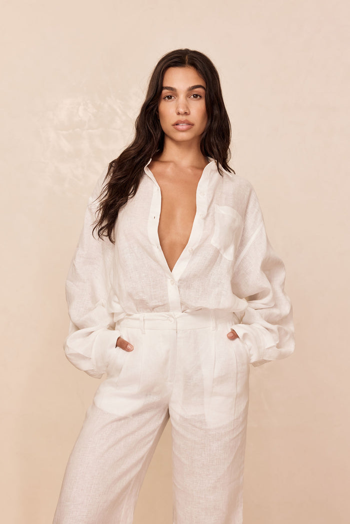Front view of La Jolla Linen Shirt in white on model showing relaxed fit, collar, chest pocket and center front buttons