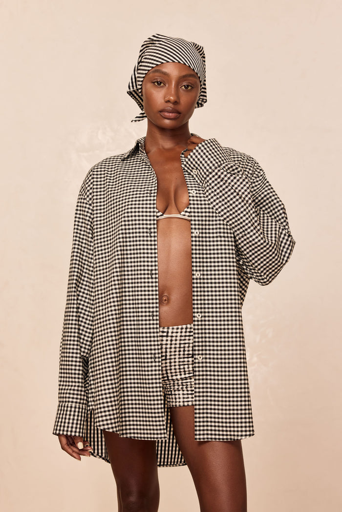 Front view of La Jolla Shirt in black gingham showcasing collar, center buttons, long sleeves, and oversized fit on model