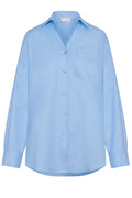 Front view of La Jolla shirt in sky blue showing button-front placket, chest patch pocket, long sleeves, and relaxed oversized fit on white background