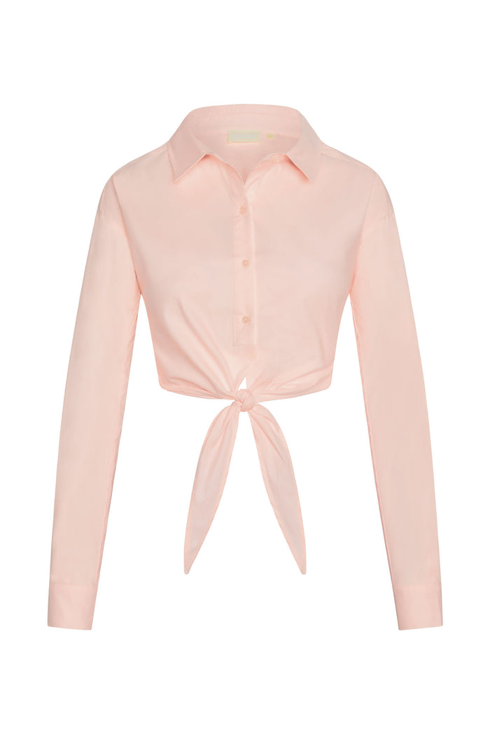 Front view of La Jolla tie shirt in powder pink showing cropped tie-front knot, button placket and sleeves on white