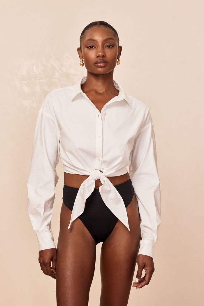 Front view of La Jolla Tie Shirt in white showcasing tie-front knot and cropped silhouette with collar and long sleeves