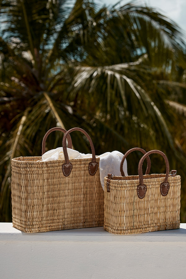 Front view of Lake Como woven seagrass tote bag (large) showcasing hand-stitched leather handles and rectangular shape