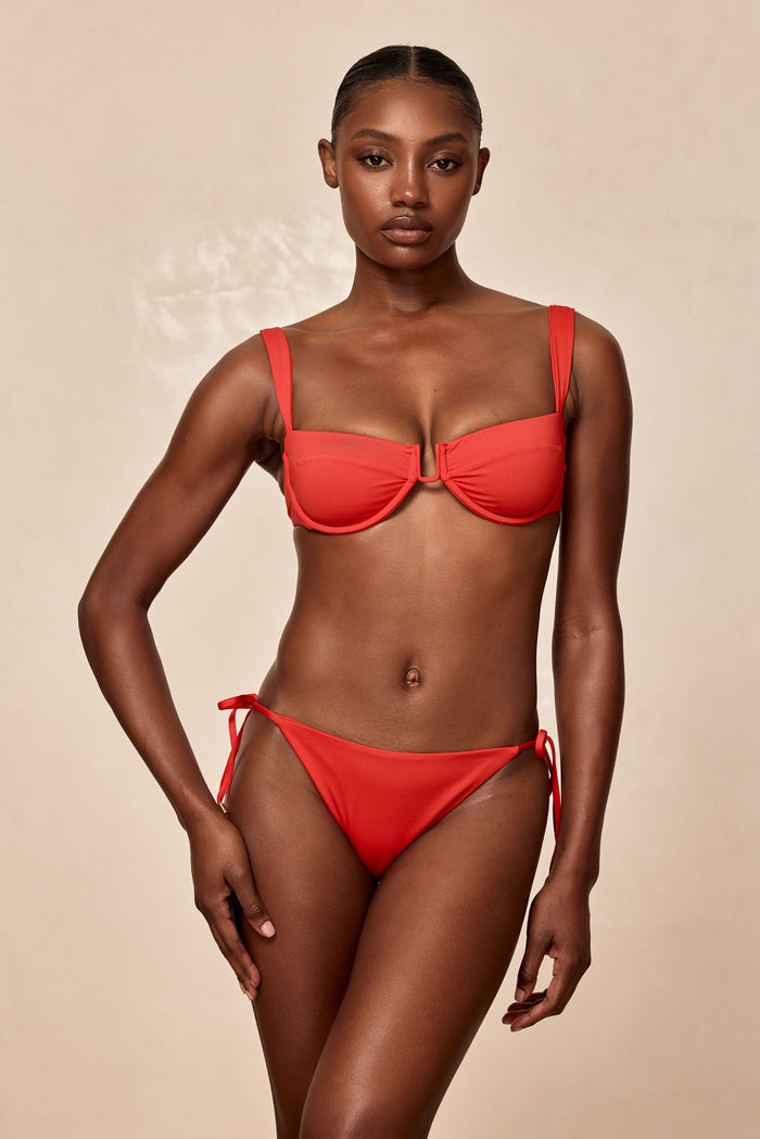 Front of Cala Roja top in Chili Pepper showing underwire balconette with U-shaped center hardware and adjustable straps