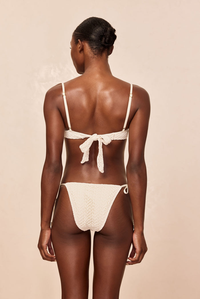Rear view of Le Marais Bottom in Ivory Crochet showing crochet texture, tie-side straps and medium-cheeky coverage