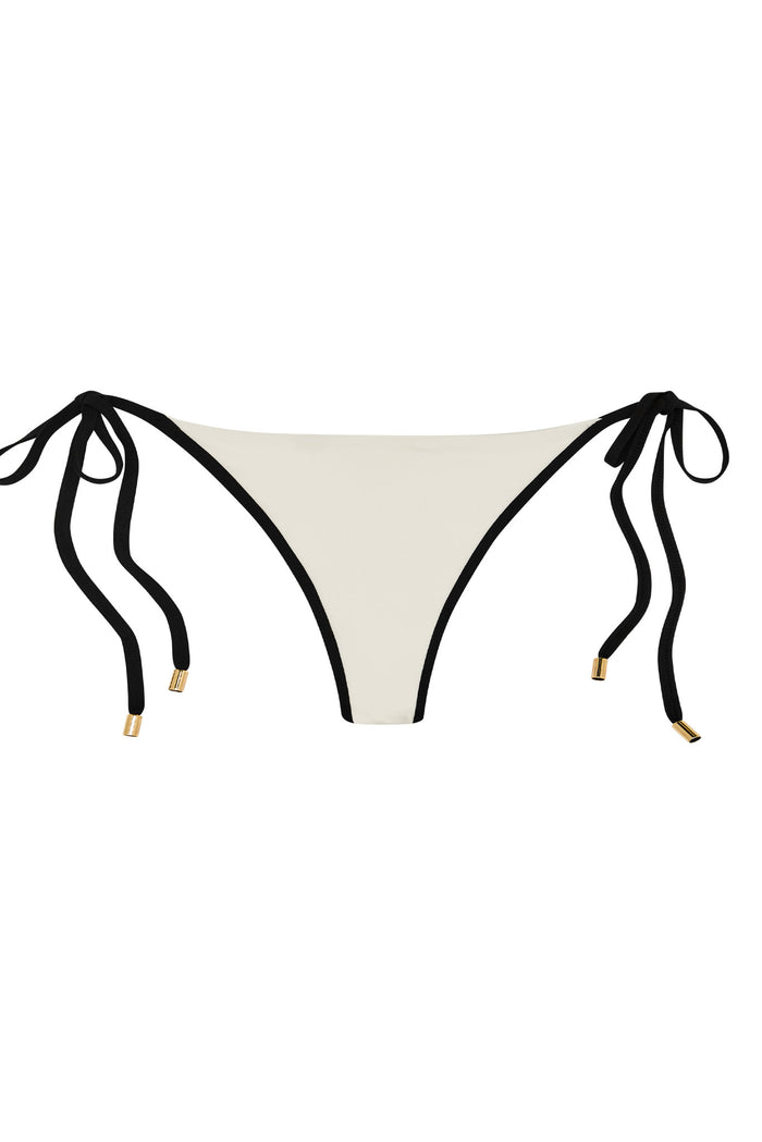 Cream bikini bottom with black trim and adjustable side ties with gold end caps.
