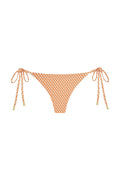 Front view of Le Marais bottom in micro geo orange print showcasing adjustable side ties and low rise cut on white background