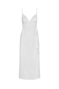 Front view of Levanzo Dress in white linen showing wrap V-neck, adjustable spaghetti straps and side tie on white background