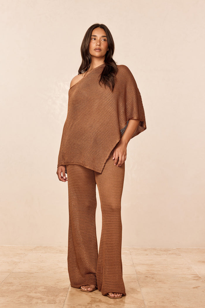 Front view of Low Rise Belize Pant in Caramel Treble Knit showing low-rise waist and wide-leg textured knit on model