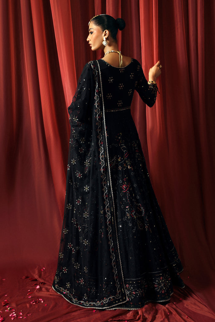 back view of NAQSHI Mah Afroz black gown showing flowy panels, angled sleeves, and sequin embroidery detail