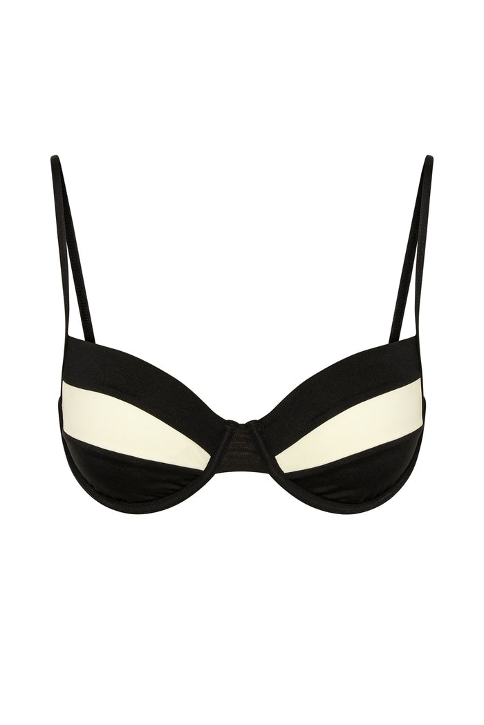 Black-and-ivory underwire bra with thin adjustable straps and curved two-tone cups.