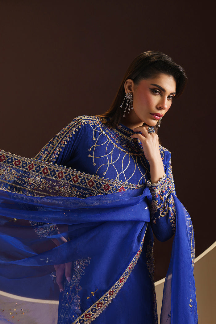 Zoom-in showing Naqshi Manvi shirt’s side slit adorned with motif embroidery, sequin-adda work and neat lace trim.