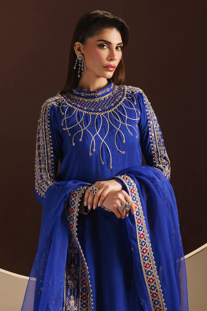 Naqshi Manvi straight PK raw-silk trousers with clean cutline, paired perfectly under the richly embellished shirt.