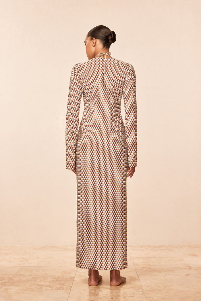 Back view of Marabella kaftan with tie-neck and long sleeves, brown-and-cream husk-geo print on beige background