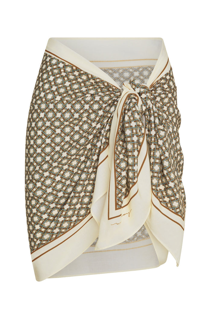 Front close-up of Marina Piccola Scarf (Tile Geo) tied as sarong, showing geometric tile print and knotted front on white background