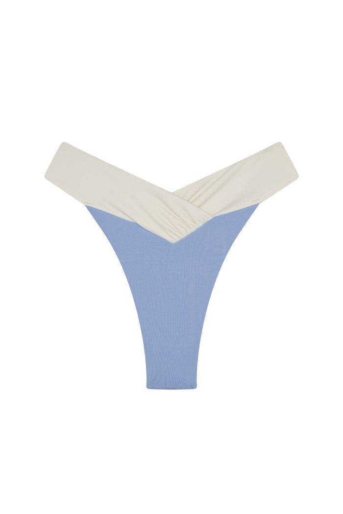 High-leg thong with V-cut blue ribbed front and cream crossover waistband.