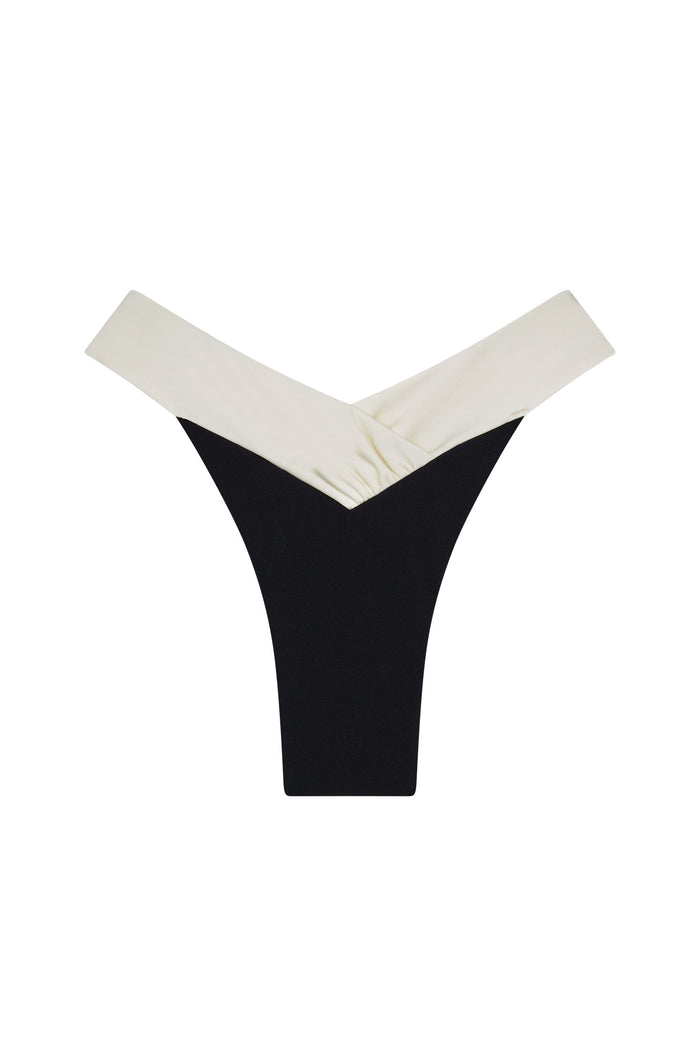 High-cut black thong swimsuit bottom with folded cream V-shaped waistband