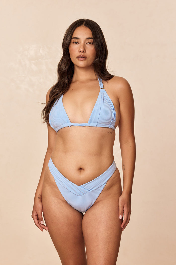 Front of Marseille bottom in Sky Rib on model, ribbed fabric, shirred V-front waist, high-leg cheeky fit