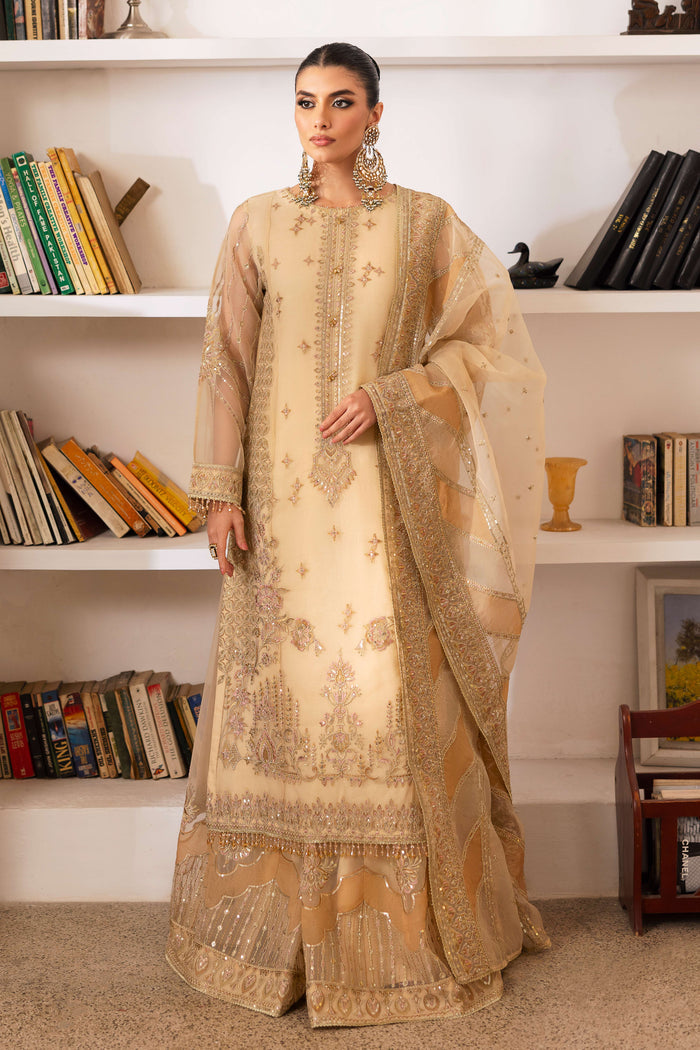 Model wearing full NAQSHI Marve outfit: straight organza shirt with boat neckline, floral sequin sharara, crystal tassels and monochrome embroidered dupatta for coordinated formal look.