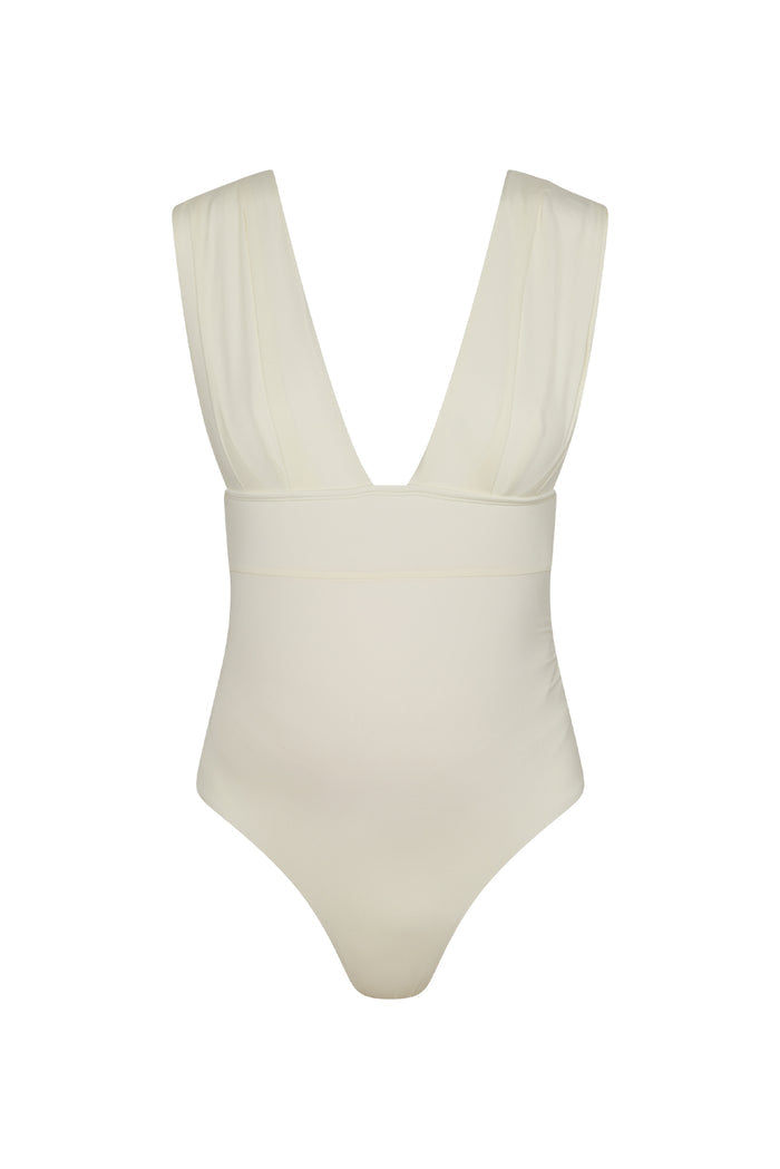 Close-up front view of Maternity Aruba One Piece in ivory showing deep V neckline, wide pleated straps and ruched tummy on white background