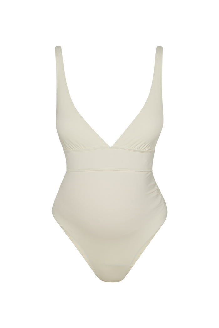 Front view of Maternity Portofino one-piece swimsuit in ivory showing deep V-neck, underbust band and maternity belly shaping on white background