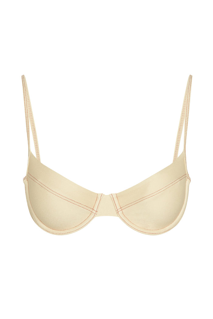 Front view of Maui Top in Champagne Denim showing underwire cups, curved seam detailing, and thin adjustable straps on white background