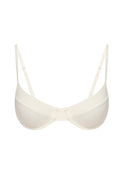 Ivory underwire balconette bra with thin adjustable straps and center front seam on white background